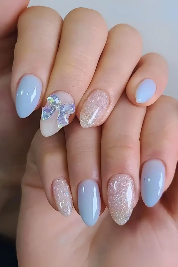 Light Blue Mani With Bows and Glitter That Sparkles Beautifully