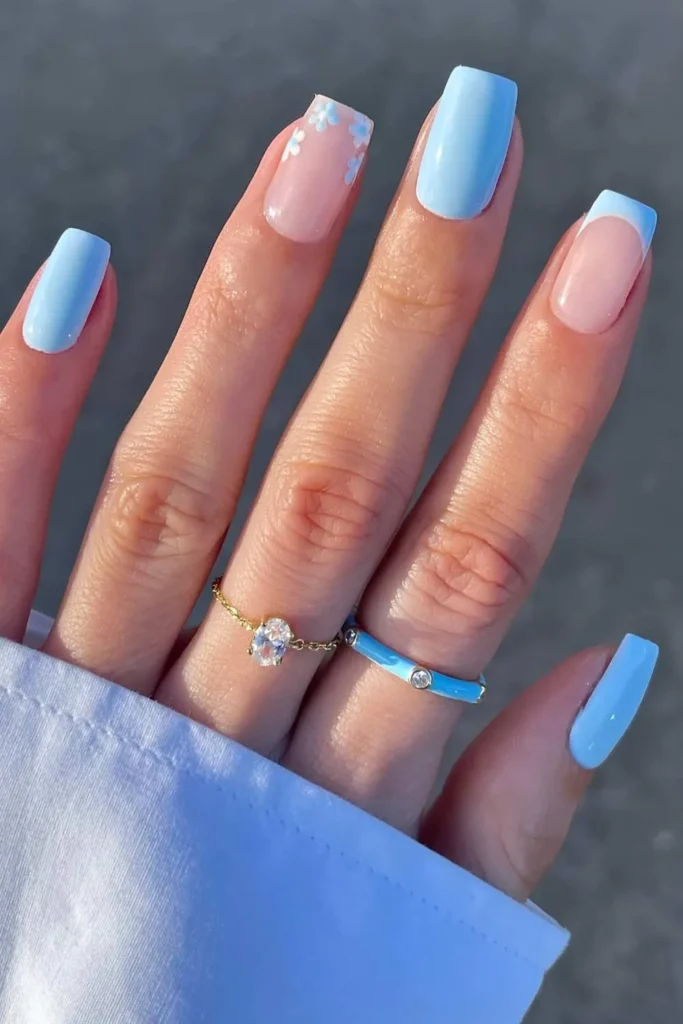 Light Blue Nails With Micro Daisy Accents for a Fresh Floral Style
