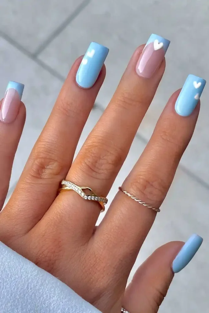 Light Blue Nails With White Hearts for a Sweet Romantic Look