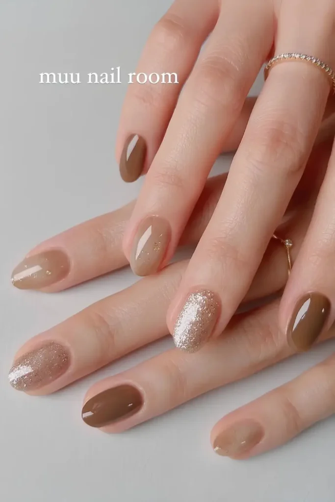 Light Brown Nails With Accent Glitter That Shine Beautifully