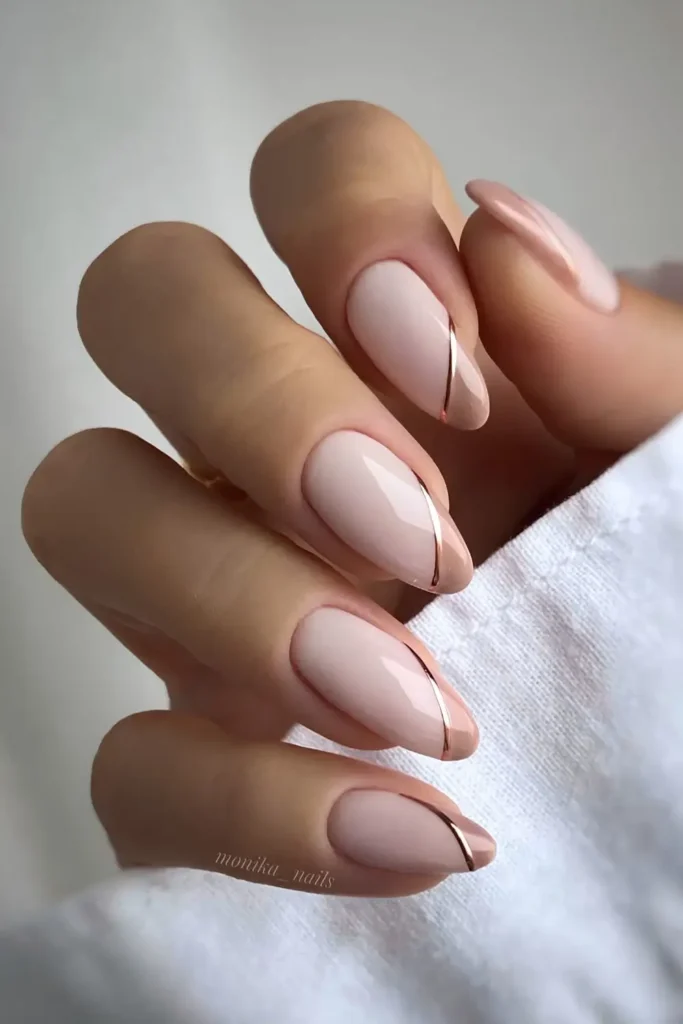 Light Brown Side French Mani With Gold Accents That Looks Sophisticated
