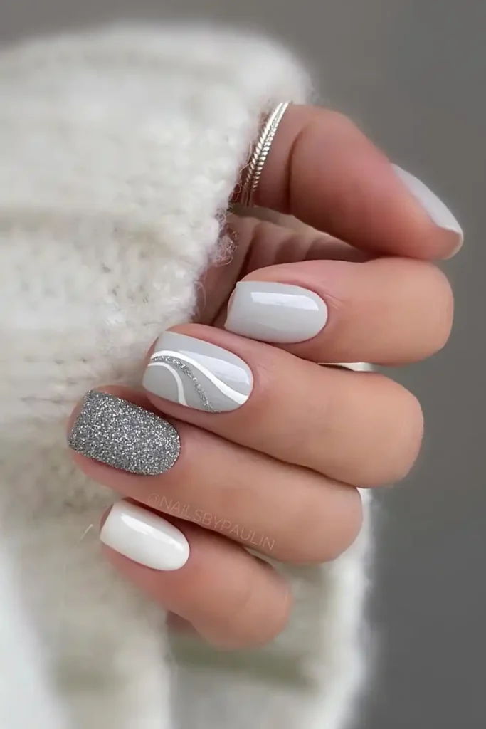 Light Gray Nails With Glitter and Swirls That Catch the Light