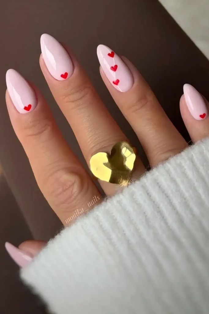 Light Pink Manicure With Accent Red Hearts