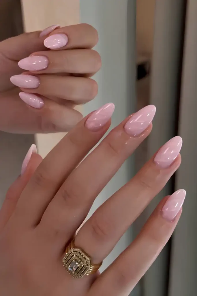 Light Pink Nails With Marble Swirls for a Beautiful Artistic Look