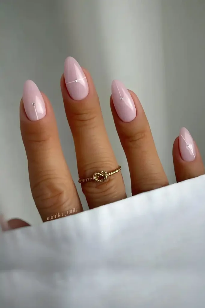 Milky Baby Pink Nails With Tiny Gems and Subtle White Lines for a Delicate Glam Look