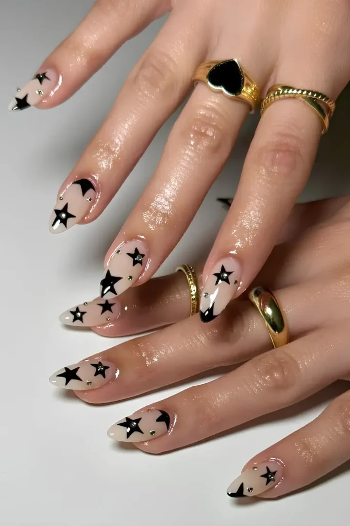 Milky Nails With Black Stars and Gems That Sparkle Beautifully
