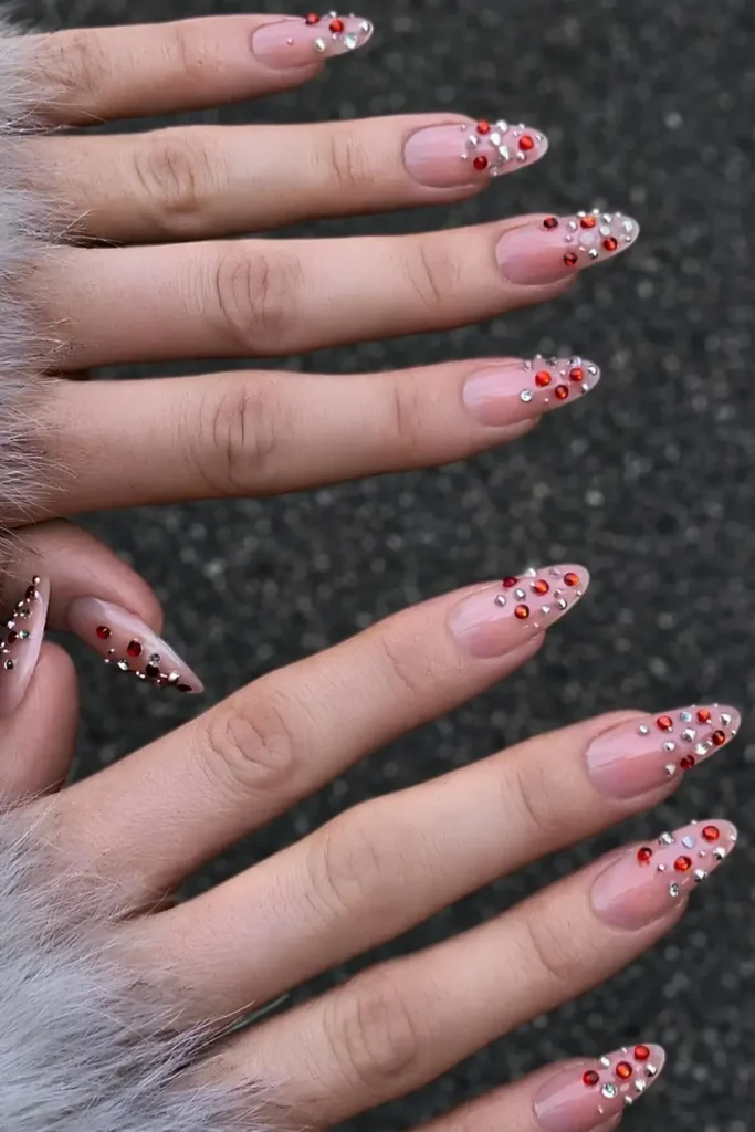 Milky Nails With Red and Silver Gems That Sparkle Beautifully
