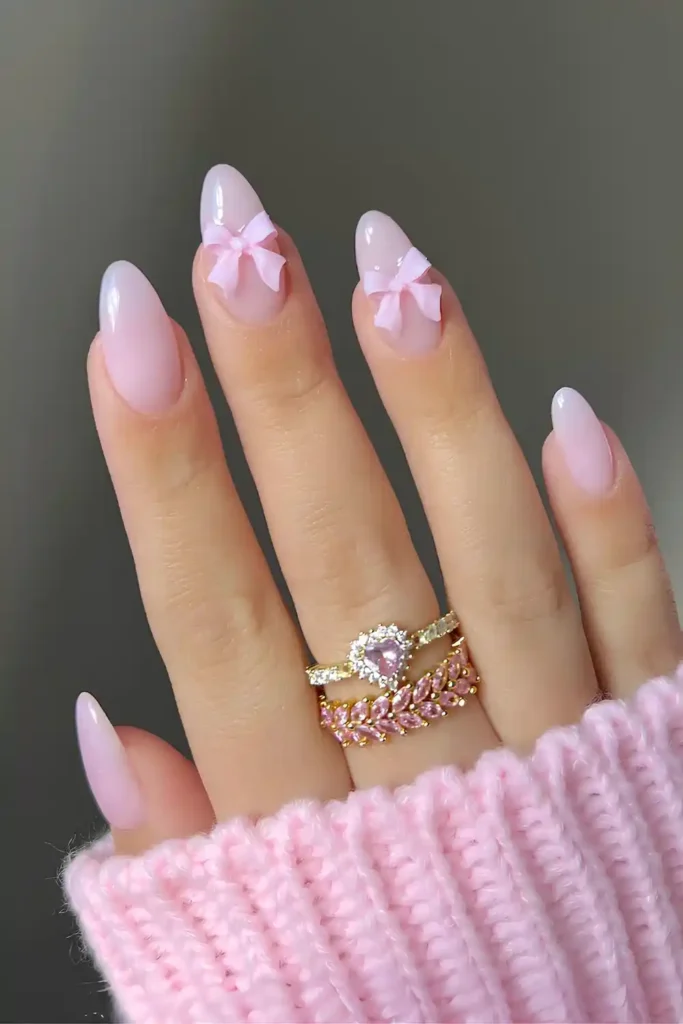 Milky Pink Nails With Coquette Bows That Look Adorable