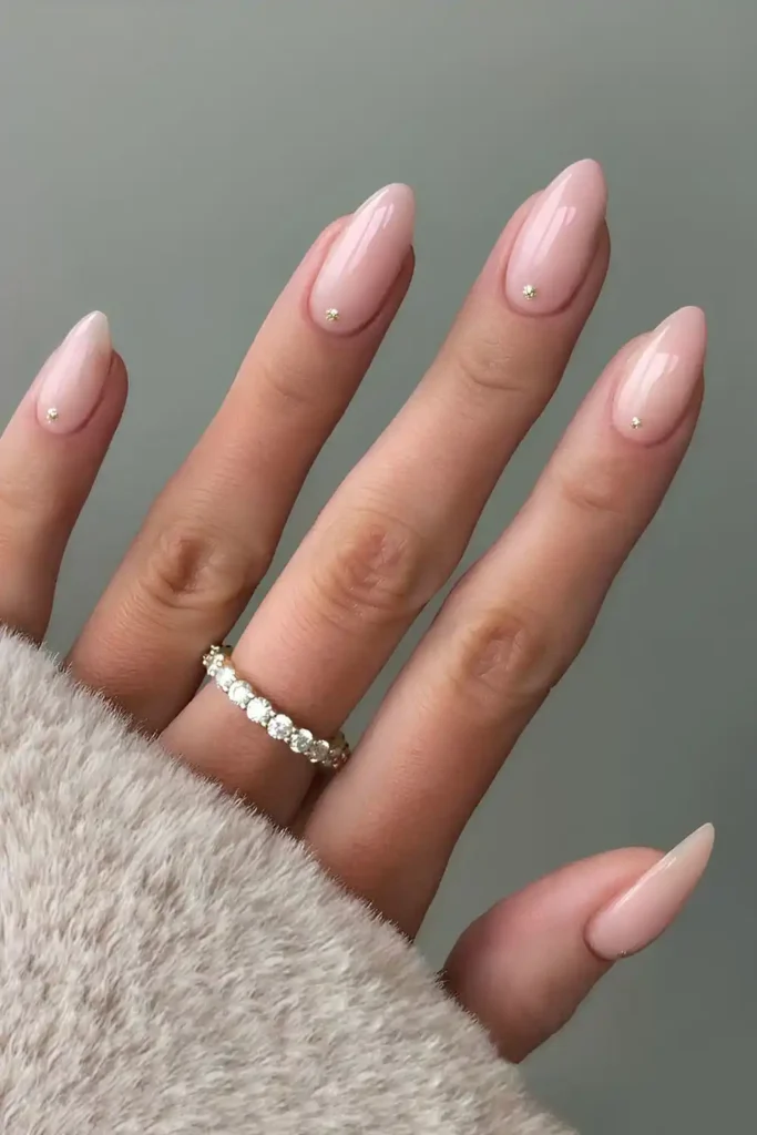 Milky Pink Nails With Glittery Dot Accents That Sparkle