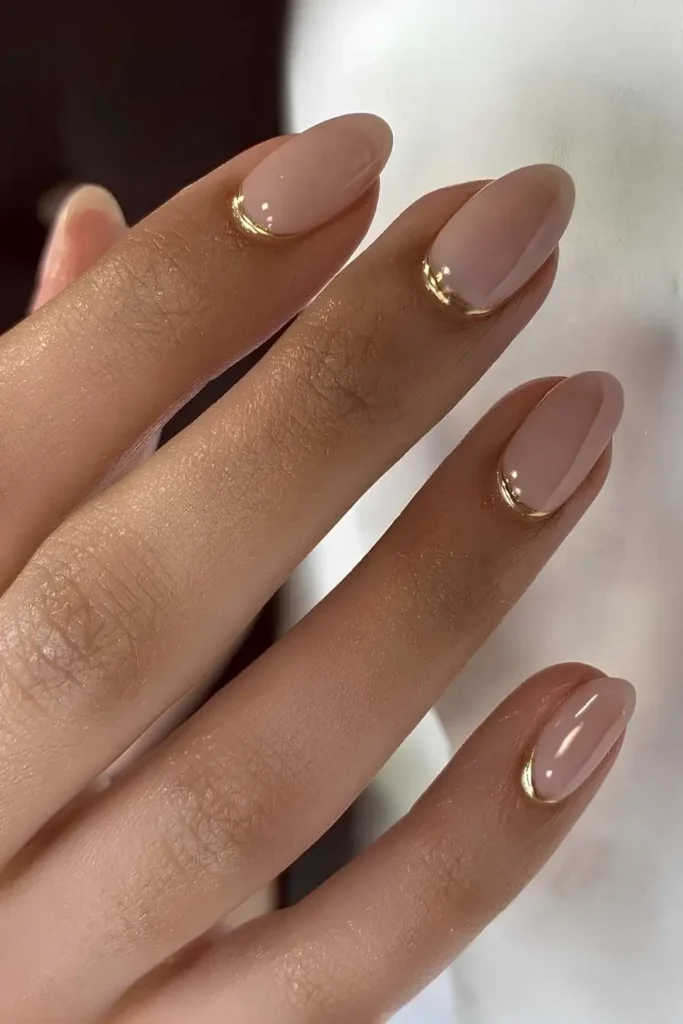 Milky Pink Nails With Gold Cuticle Cuffs for a Chic Modern Style