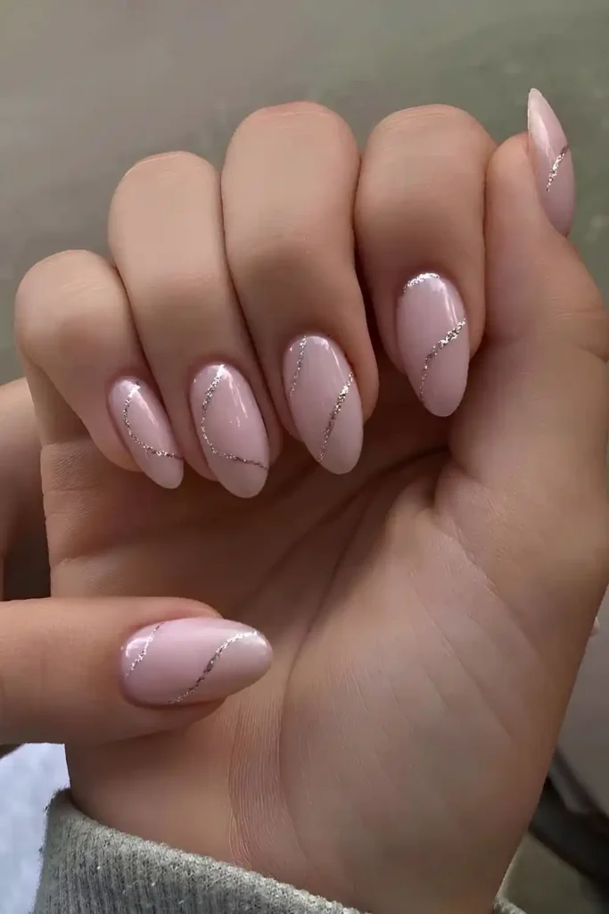 Milky Pink Nails With Silver Glitter Lines That Shine Bright