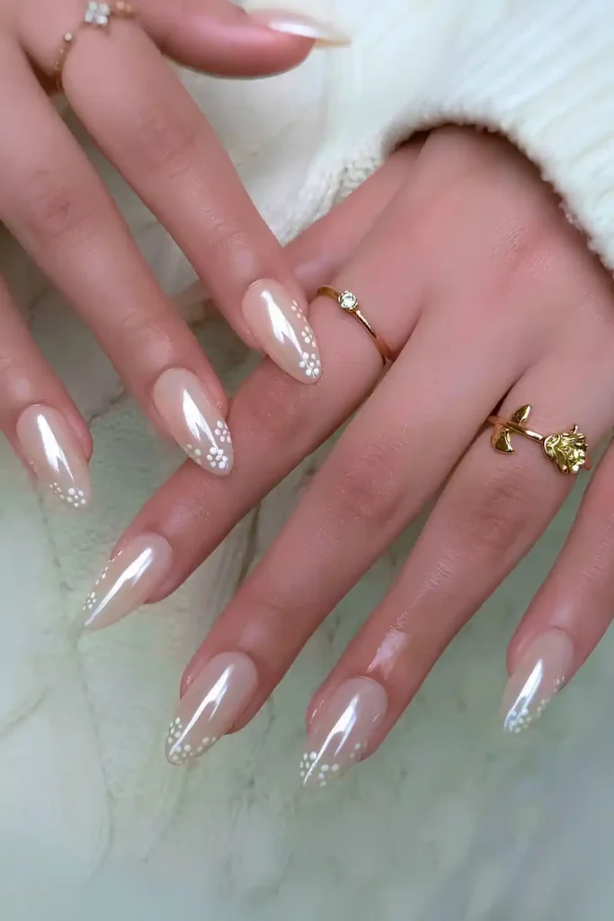 Milky White Chrome Nails With Florals That Sparkle Elegantly