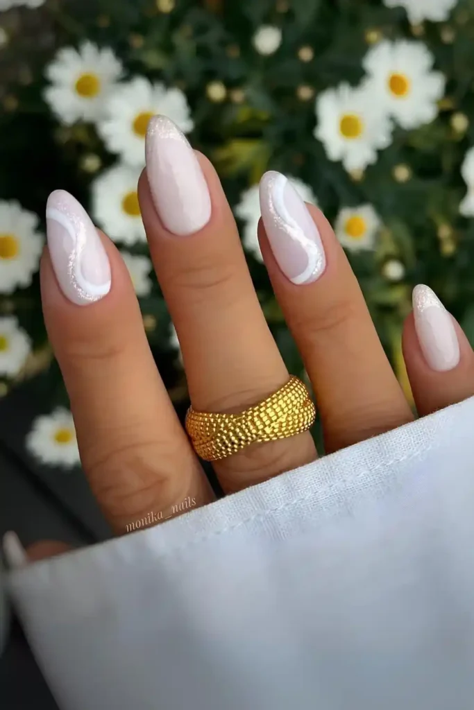 Milky White Nails With Glittery Swirls That Catch the Light
