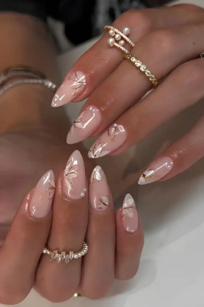 Milky White Nails With Gold Floral Art That Looks Sophisticated