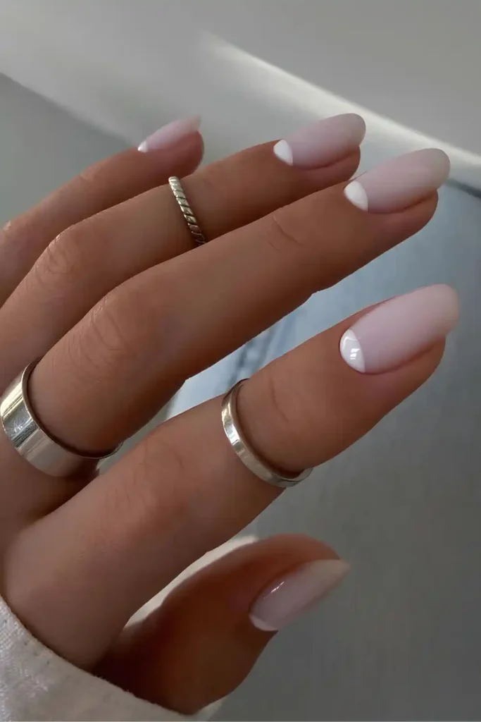 Milky White Nails With Half Moon Accents for an Elegant Finish