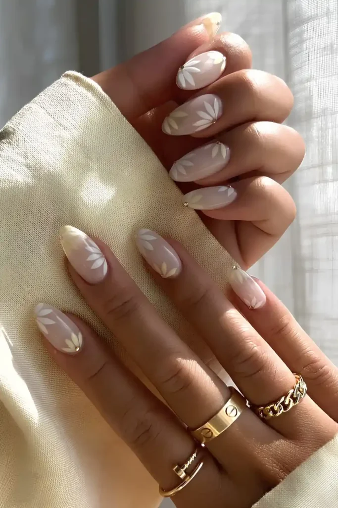 Milky White Nails With White Petal Art for a Soft Elegant Look