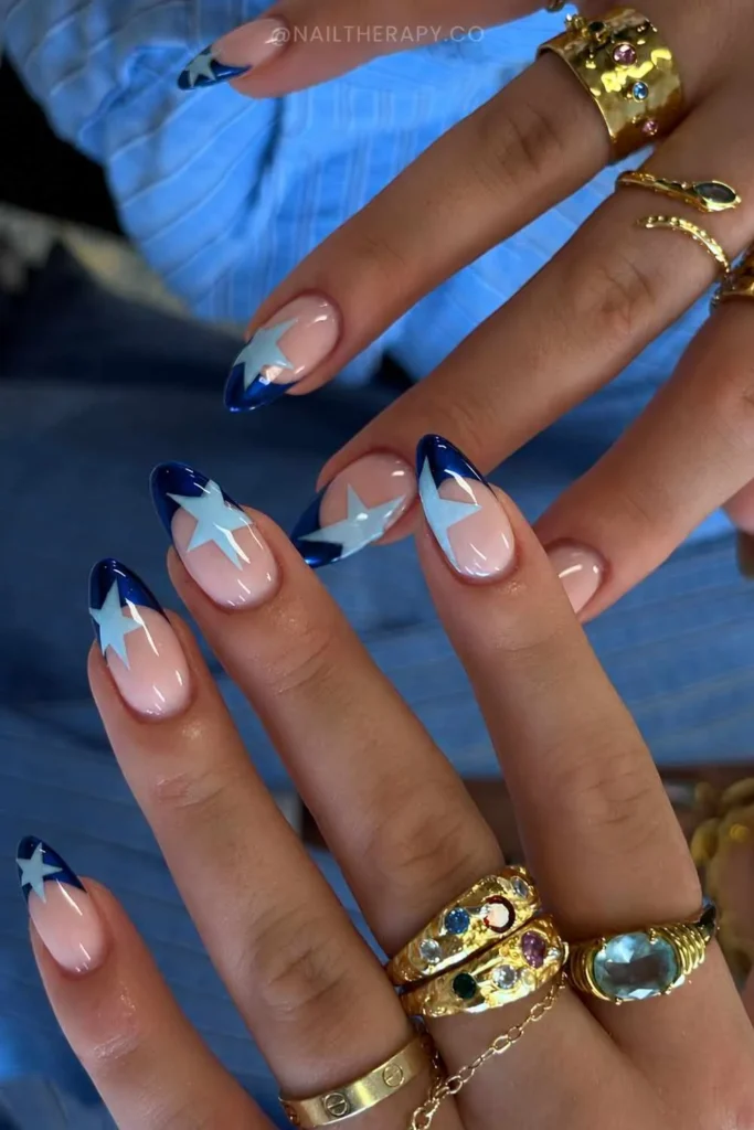 Navy French Mani With Baby Blue Stars for a Dreamy Night Sky Look