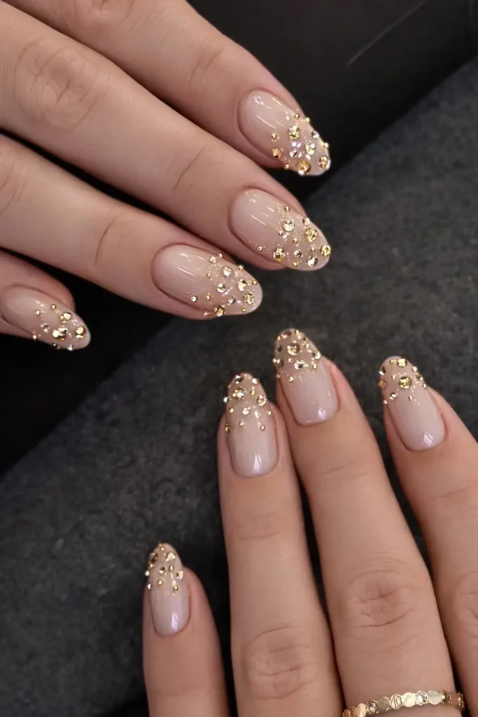 Neutral Mani With Gold Rhinestone Ombre for an Elegant Look