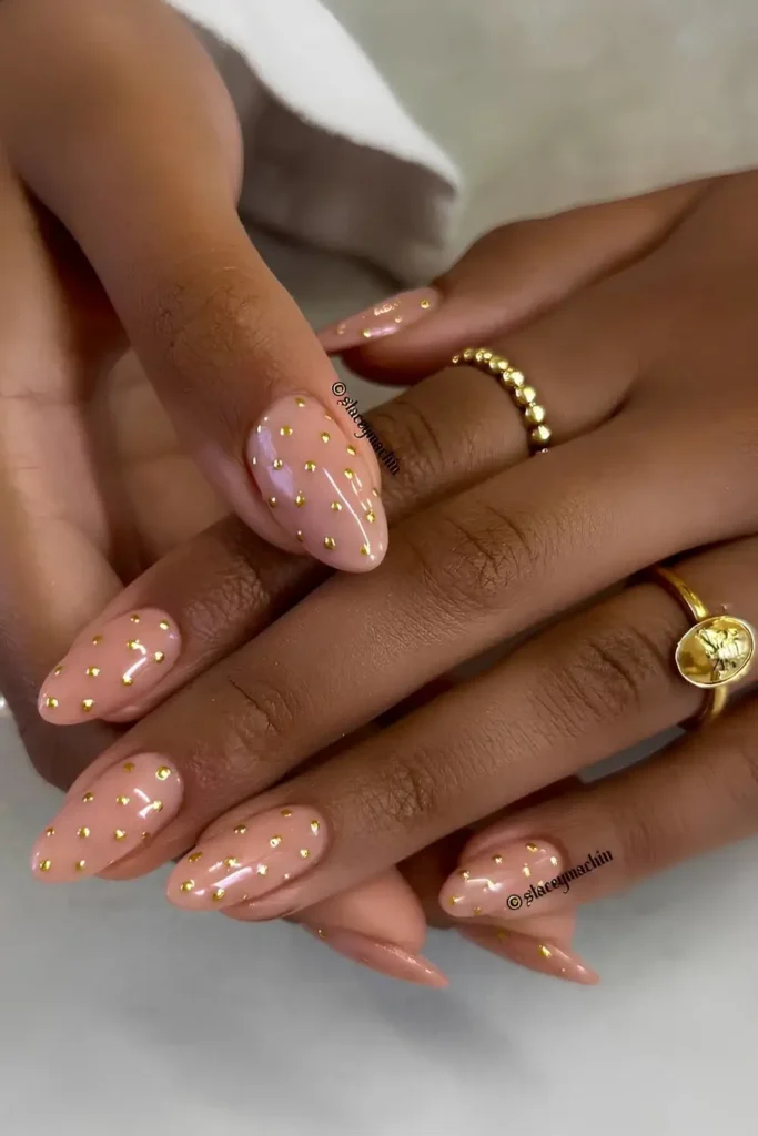 Neutral Nails With Gold Polka Dot Art for a Playful Elegant Touch