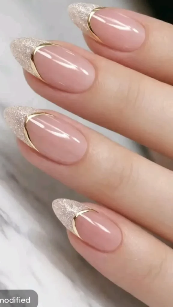 Nude Glitter French Nails With Elegant Gold Curve Detail