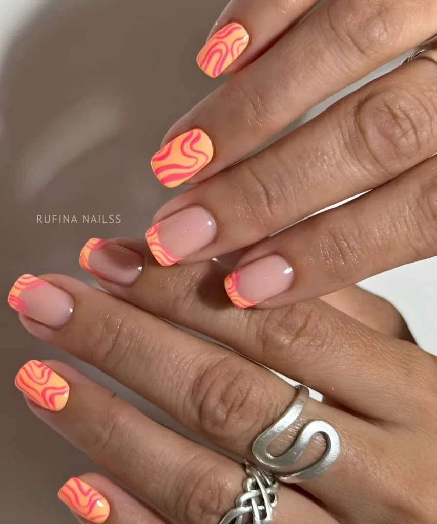 Orange Mani With Freeform Pink Swirls That Looks Artistic