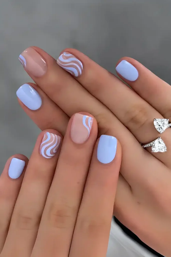 Pastel Blue Nails With Swirly Accents for a Playful Look