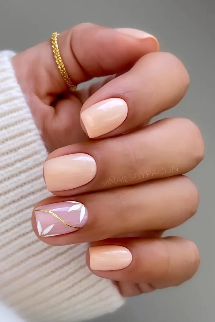 Pastel Peach Nails With Elegant Floral Art That Looks Timeless