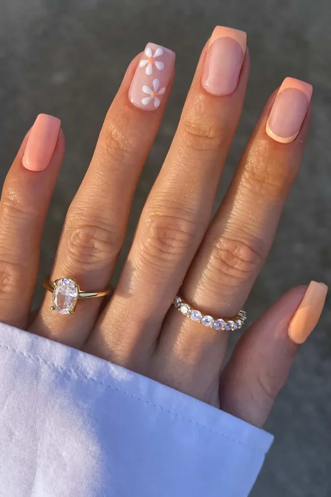 Peach Nails With Daisy Flower Art for a Fresh Spring Look