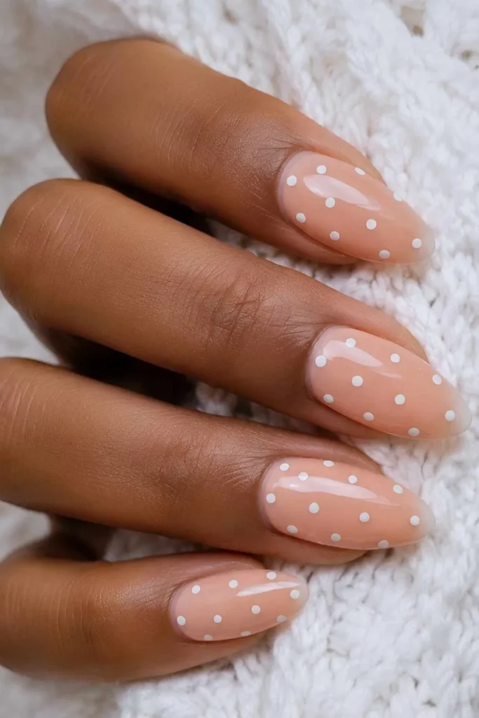 Peach Nails With White Polka Dots That Feel Cute and Playful