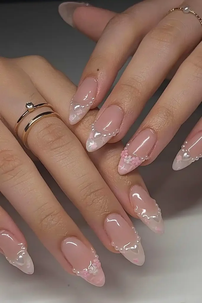 Pearly White and Pink French Almond Tips With Florals and Pearls That Look Elegant