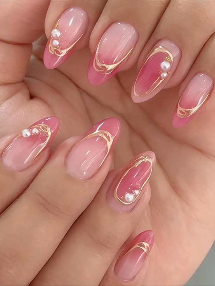 Pink Aura Nails With Gold Swirls and Pearl Accents
