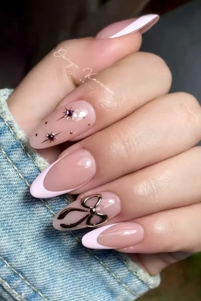 Pink French Nails With Silver Stars and Bows for a Dreamy Glam Look