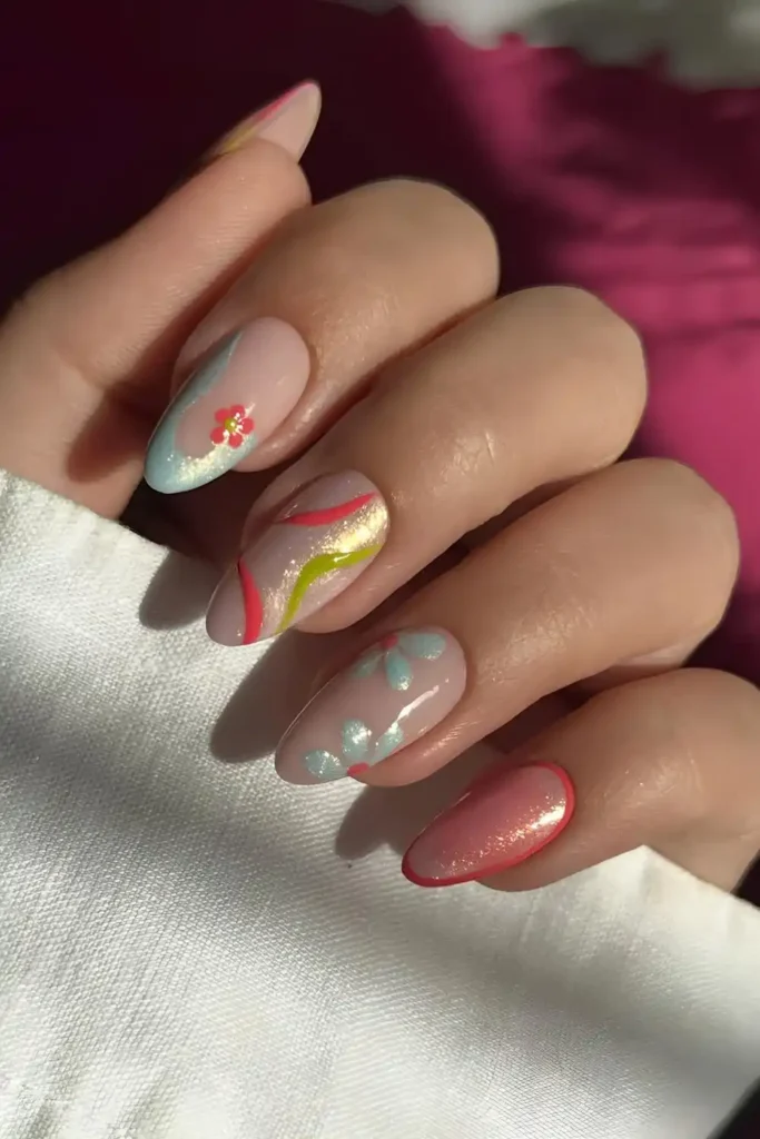 Pink and Blue Shimmer Nails With Flowers and Lines That Sparkle Beautifully