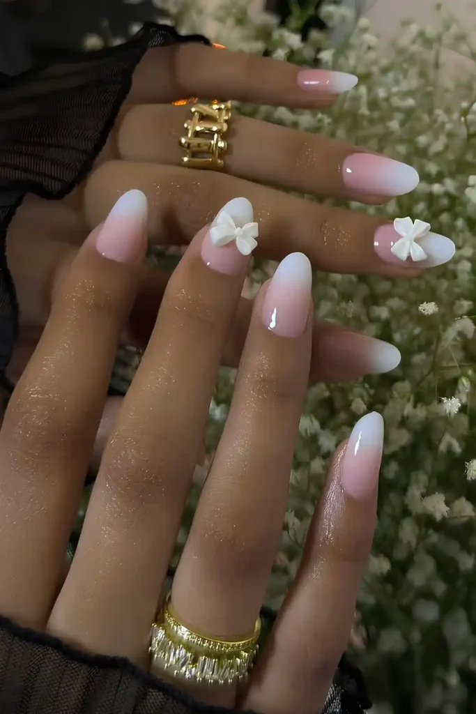 Pink and White Ombre Nails With 3D Bows for a Feminine Touch