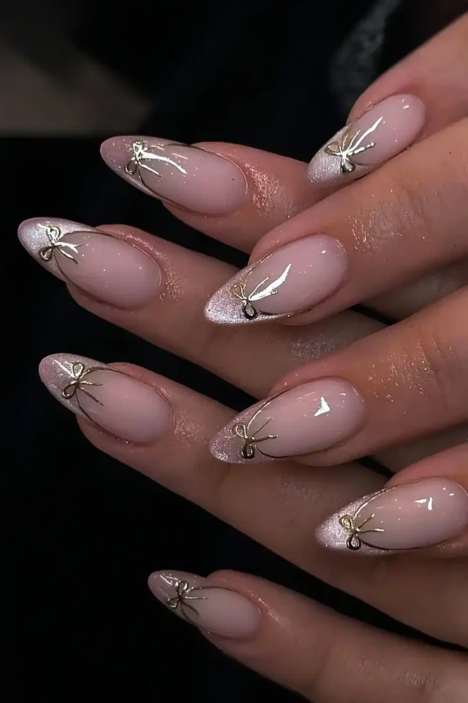 Pink Cat Eye French Mani With Gold Bows That Looks Luxurious