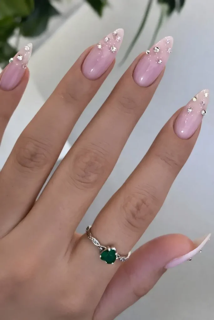 Pink Nails With Rhinestones at the Tips That Sparkle Beautifully