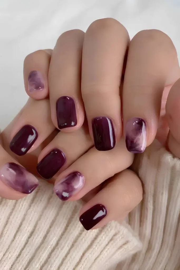 Plum Nails With Marble Art for an Elegant Look