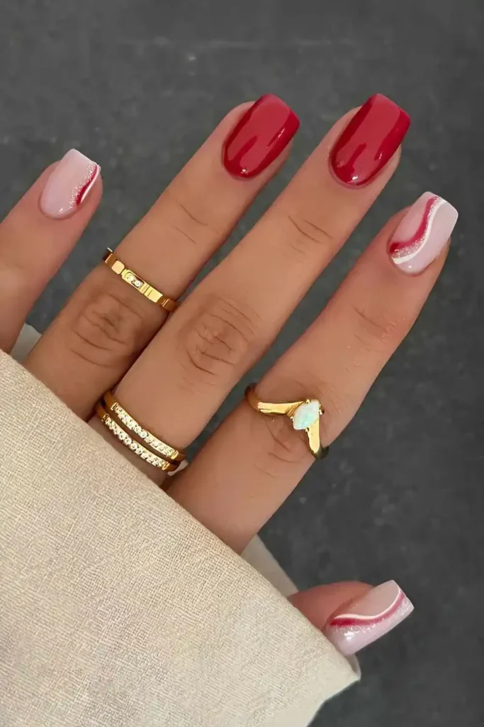 Red and White Nails With Accent Swirls for a Bold Elegant Look