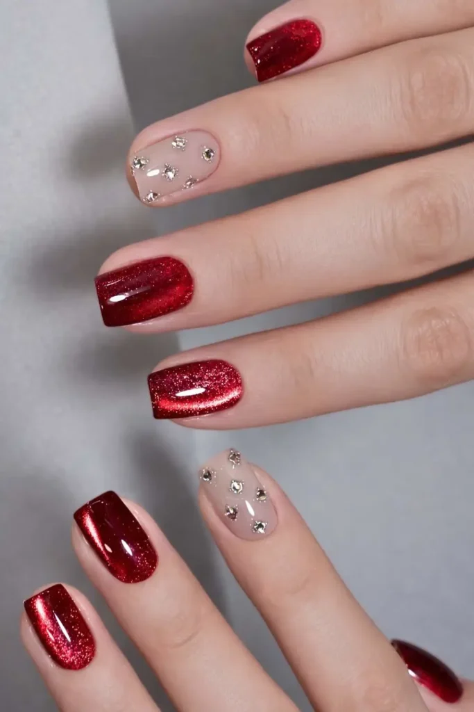 Red Cat Eye Nails With Gems for a Bold Glam Look