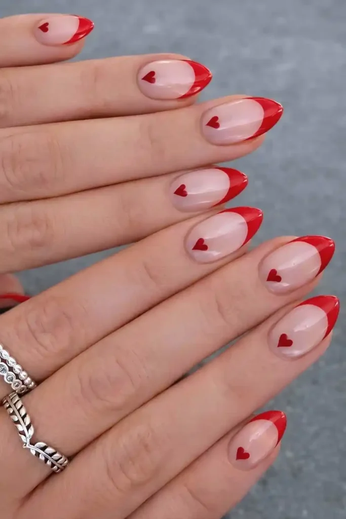 Red French Nails With Cuticle Heart Art for a Sweet Romantic Touch