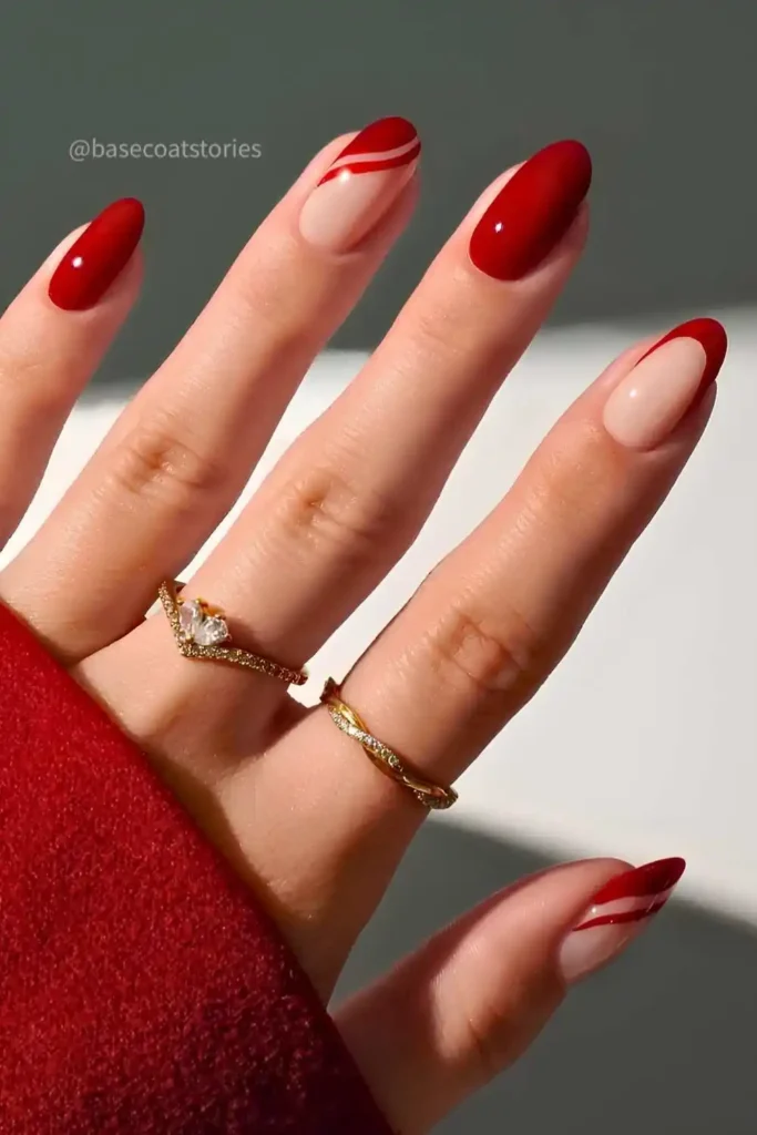 Red Nails With Accent Swirls and French Tips for a Chic Modern Style