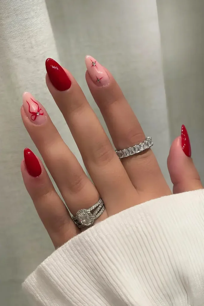 Red Nails With Bows and Starbursts That Stand Out