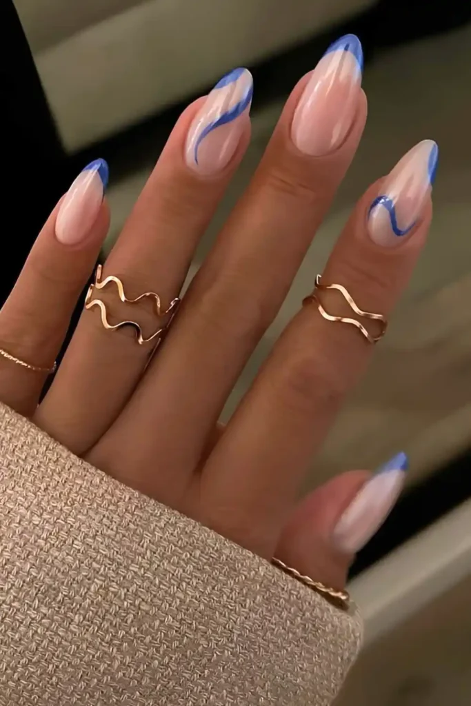Royal Blue French Nails With Swirls and Chrome Overlay That Look Luxurious