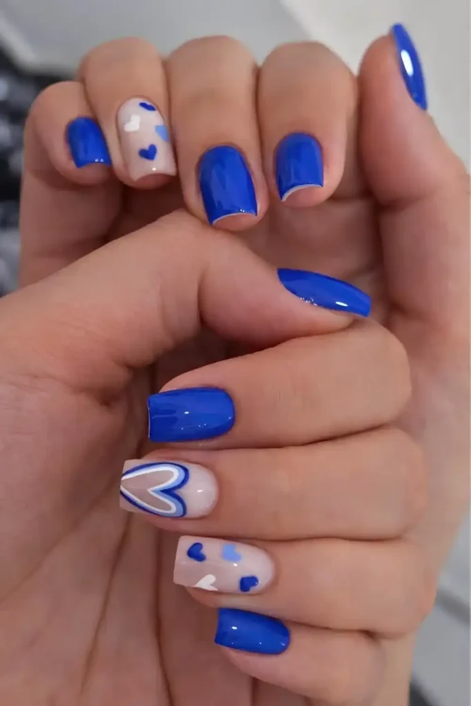 Royal Blue Manicure With Accent Hearts for a Sweet Elegant Finish