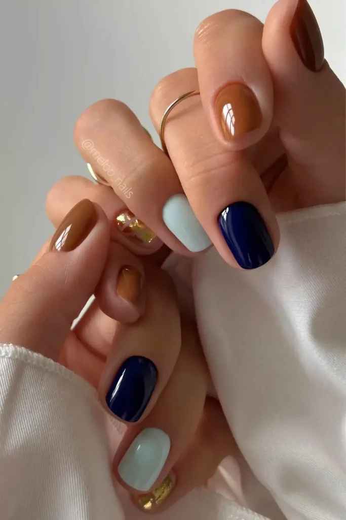 Short Brown and Blue Nails With Gold Accent That Look Luxurious