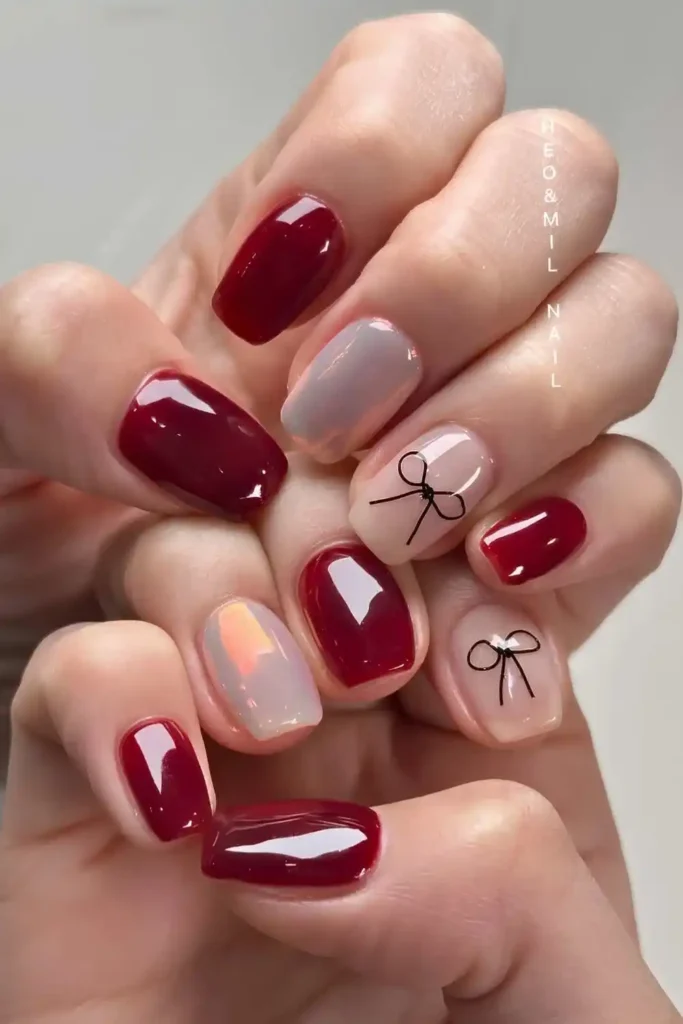 Short Red and White Nails With Bows for a Cute Feminine Touch