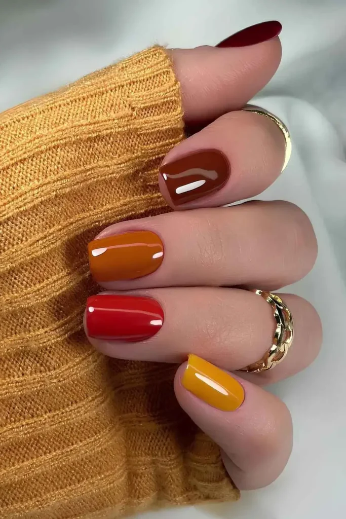 Short Skittle Mani in Orange and Red Tones for a Fun Fall Look