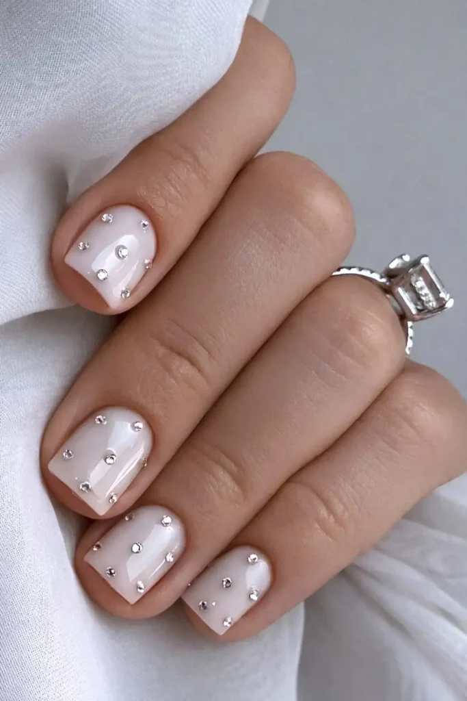 Short White Bedazzled Nails That Shine Beautifully