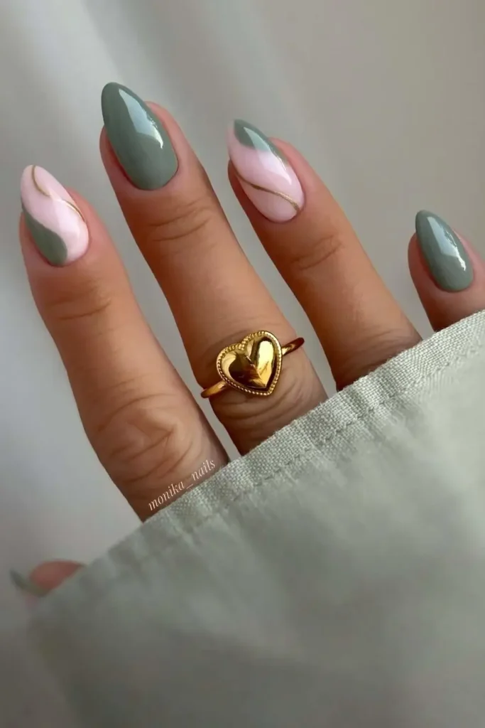 Soft Green Nails With Accent Gold Lines for a Sophisticated Finish