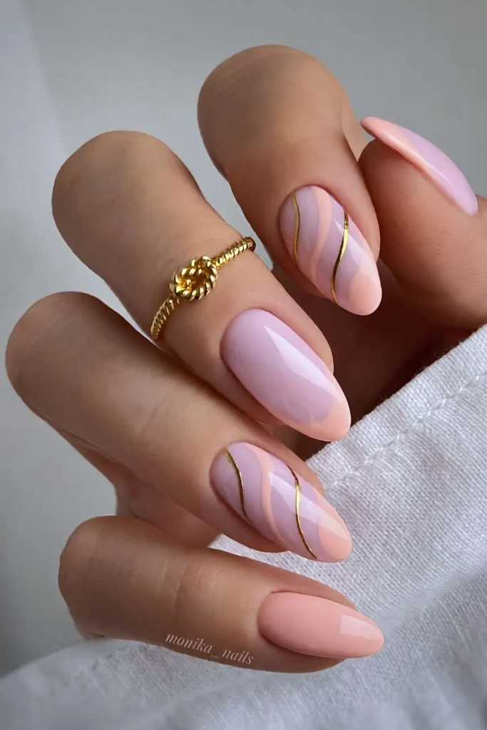 Soft Peach Nails With Metallic Line Art for a Modern Elegant Finish